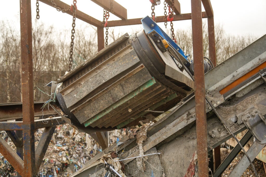 Bunting ElectroMax overband magnet installed in an industrial waste recycling plant