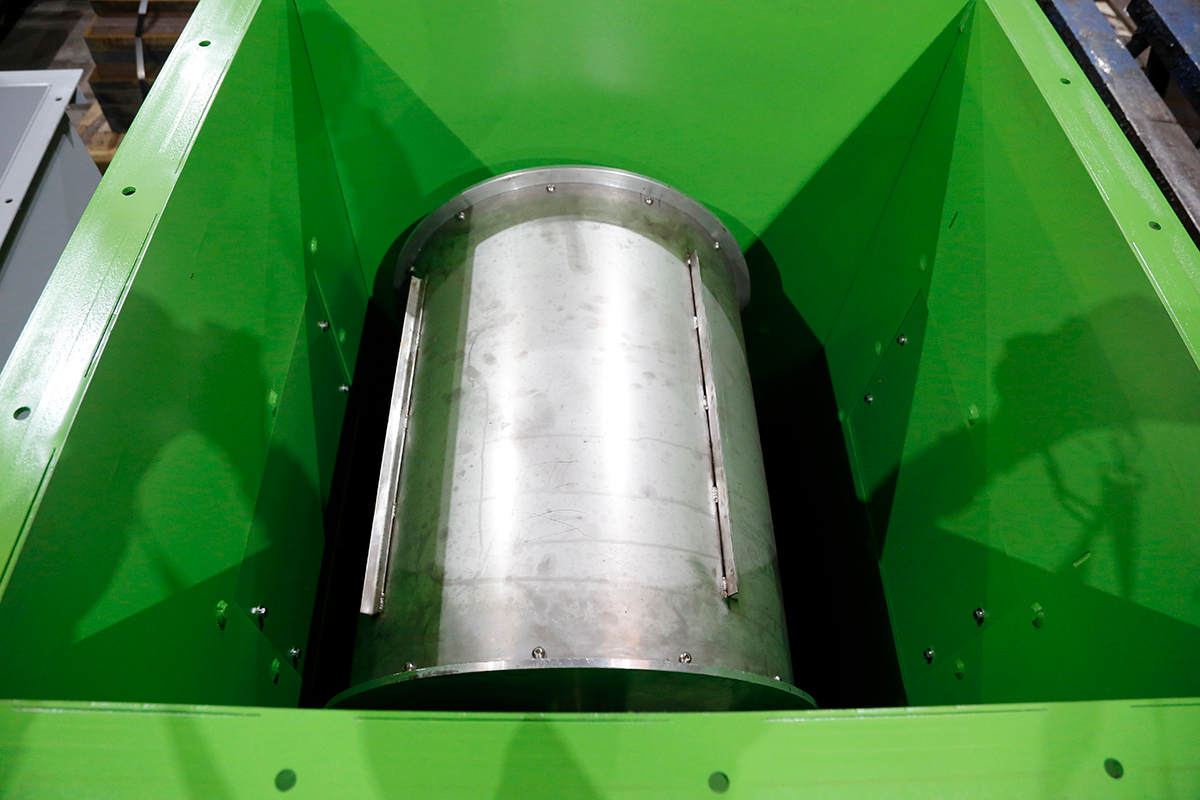 Permanent drum magnet inside a green housing